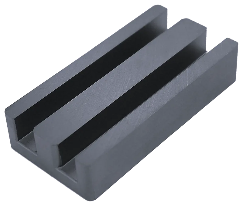 Large-format ferrite E-core with two slots and three limbs, shown against a plain background